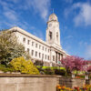 Barnsley Town Hall on a fine spring day, with blue sky and gardens in bloom.