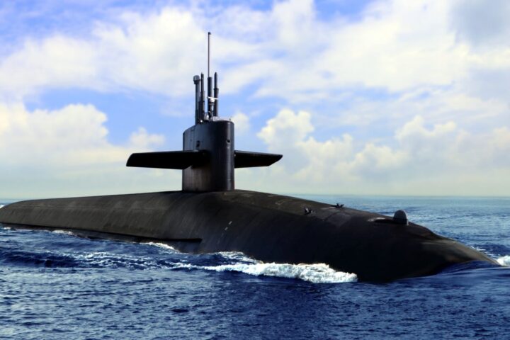 Naval submarine on open blue sea surface