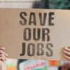Save our jobs sign at protest
