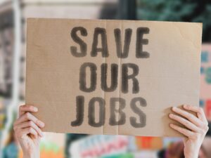 Save our jobs sign at protest