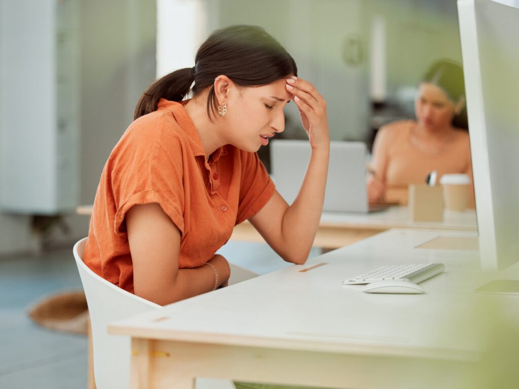 Lady with endometriosis and digestion illness at work