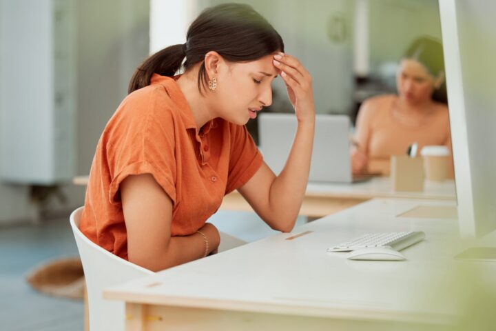 Lady with endometriosis and digestion illness at work