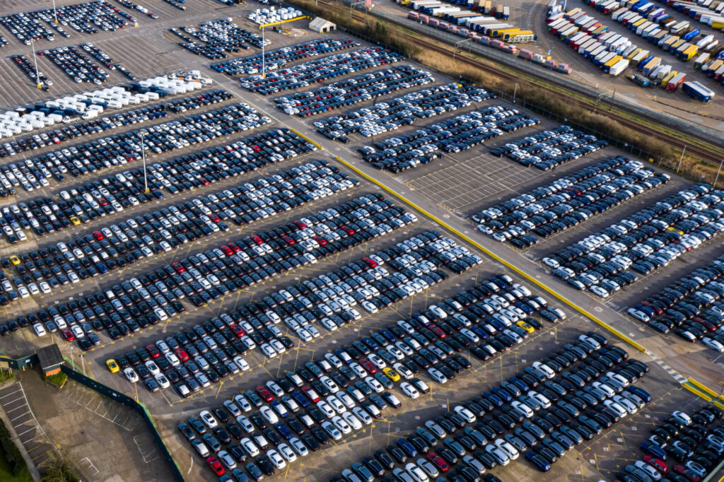 Aerial view car ship, New Cars produced up in the port for ship and import-export united kingdom