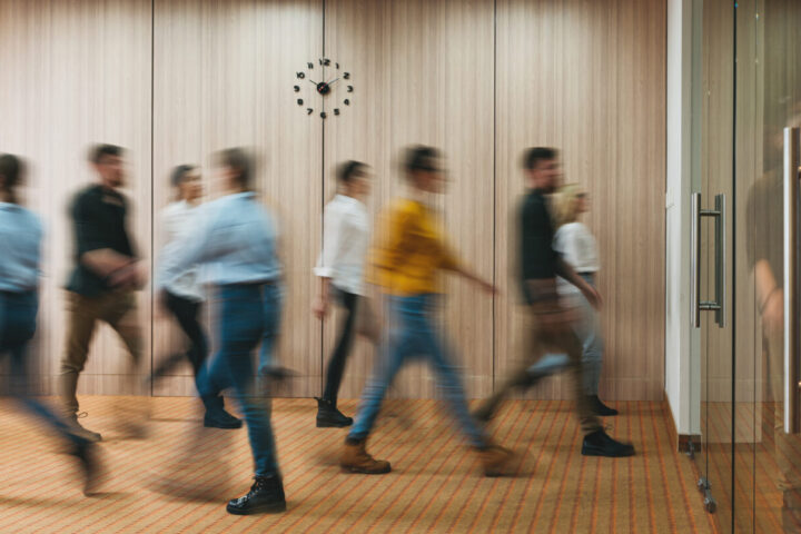 Group of office people walking at office open space. Team of business employees at coworking center. People at motion blur. Concept working at action